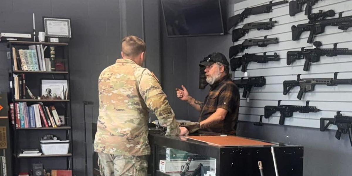 Jason talking with a soldier inside The Armament Shop in Copperas Cove